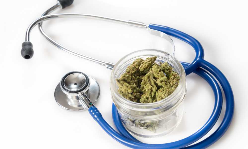 stethoscope and clear jar of cannabis