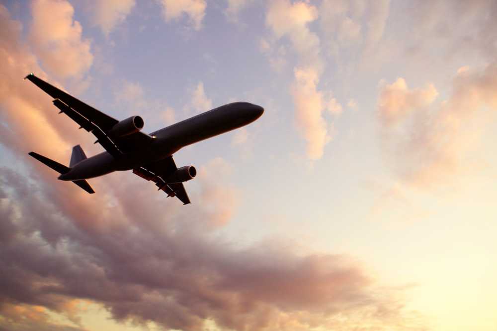 airplane flying at dusk