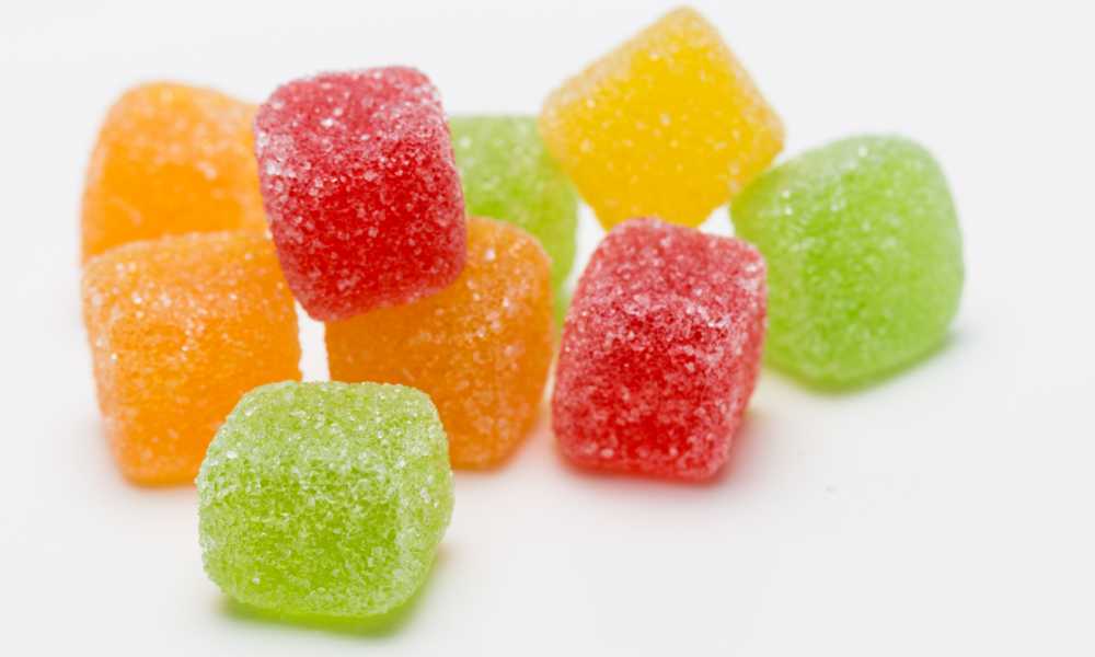 closeup of gummy cubes red yellow green