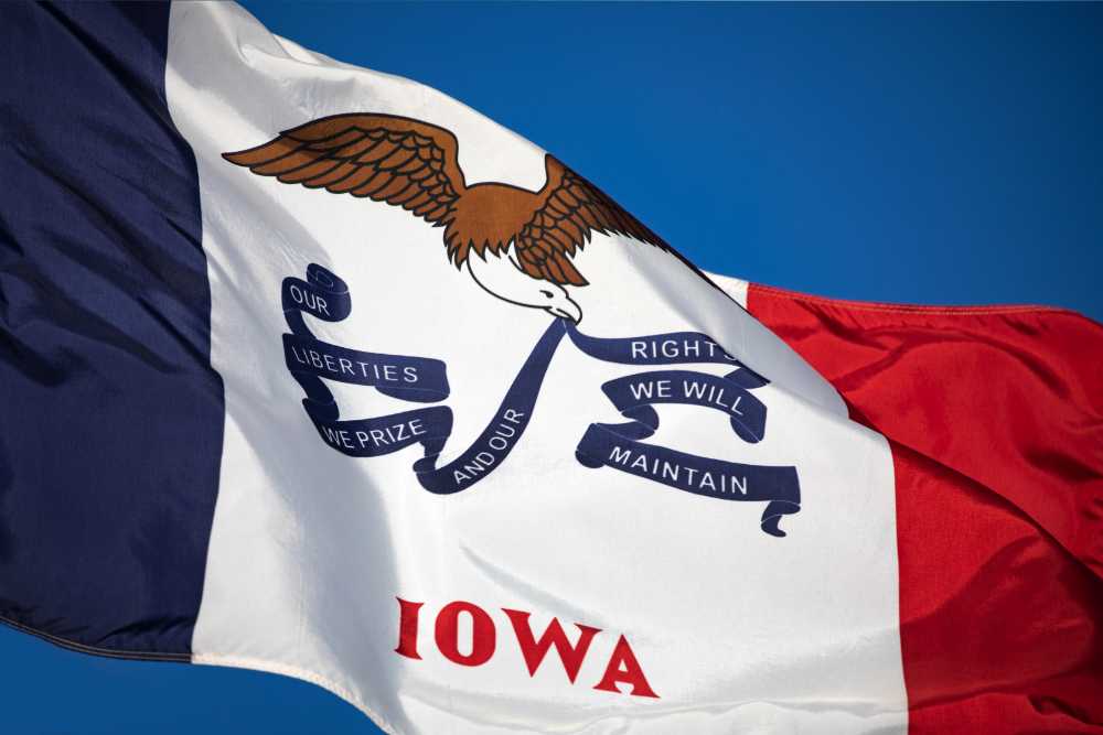 iowa flag against blue sky