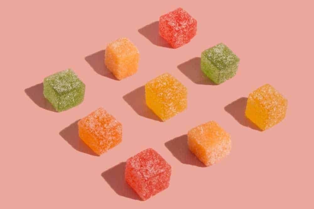 nine colorful gummy cubes lined up in rows