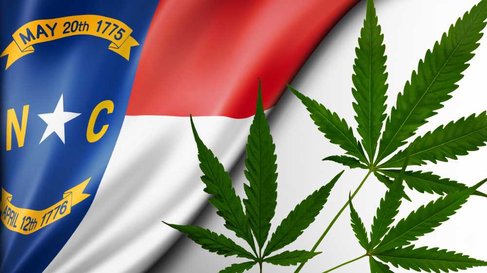 north carolina flag with cannabis leaves